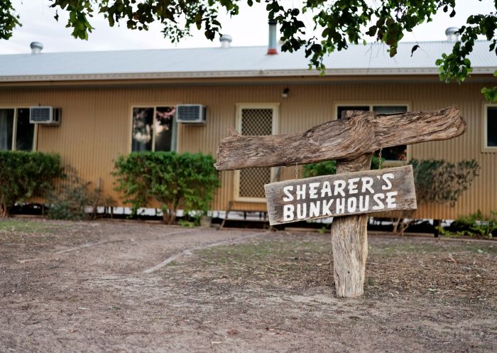 Signs outside bunkhouse accommodation at Trilby Station, Louth