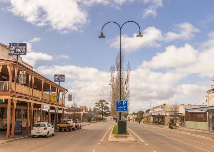 Streetscape of High Street featuring the historic Club House Hotel, Hillston 