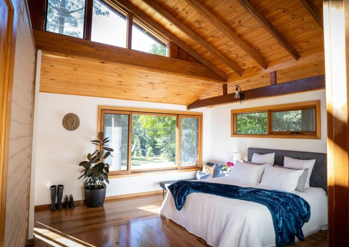 Sunlit bedroom at Carawirry Forest Escape, Main Creek
