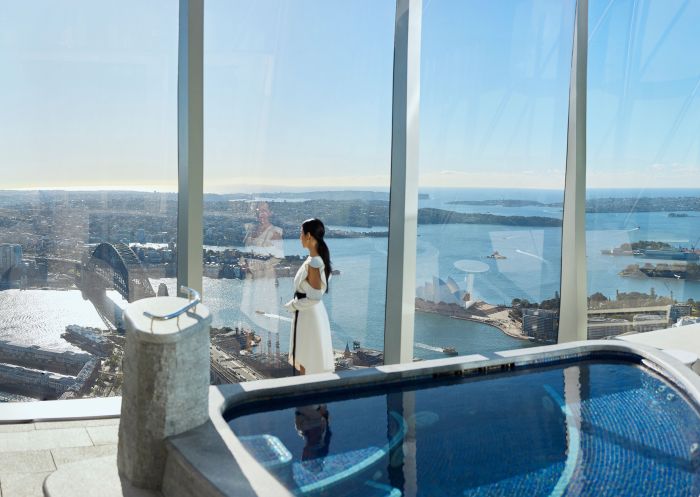 Woman admiring the expansive views from Crown Towers, Sydney