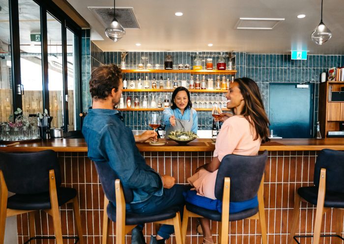 Couple enjoying lunch at the bar at Pipit Restaurant, Pottsville