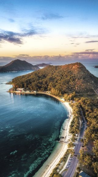 Aerial overlooking Shoal Bay, Tomaree Head and Mount Yacaaba in Port Stephens