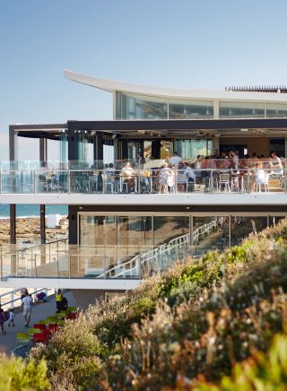 People enjoying food and drink with ocean views, Merewether Surfhouse, Newcastle