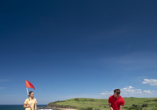 Couple enjoying a scenic round of golf at Kiama Golf Club on the South Coast